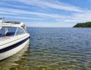 Båt, sjö och horisont.