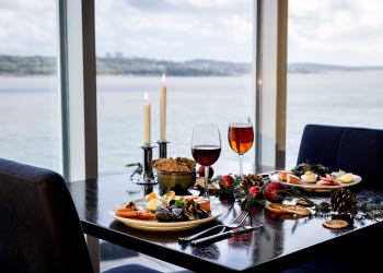 Set table with Christmas food.