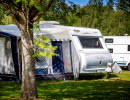 People hanging out at a campsite.