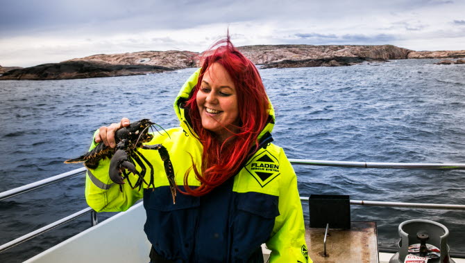 Women holding a lobster