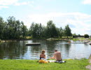 A small swimming lake in a lush landscape
