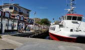 A long line of people in front of the Kosterferry in Strömstads northen harbour. 