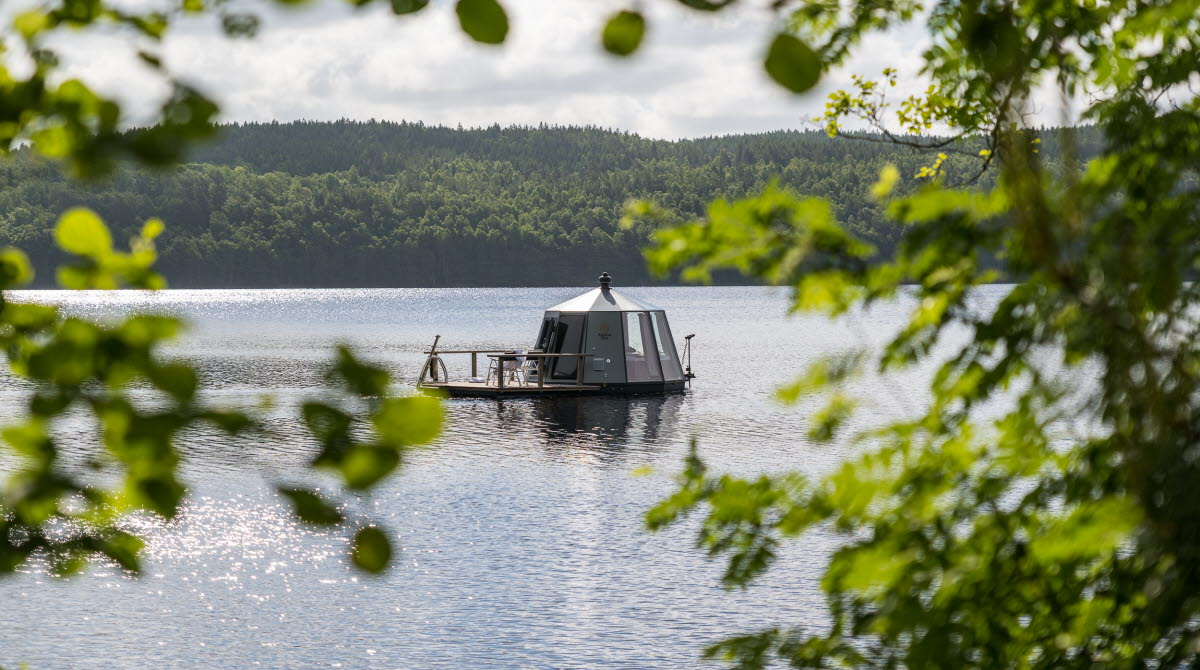 Igloo shaped boat in a lake.
