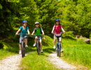 Photo of three persons on bikes.