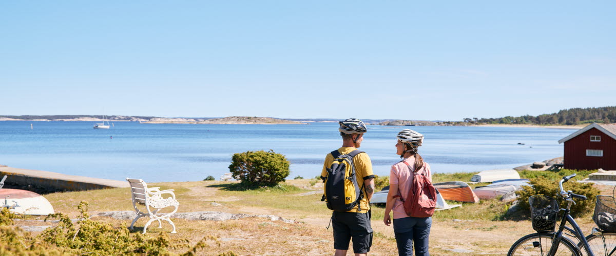 Two people are cycling on an island.