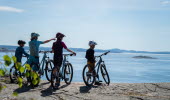 Family bikes on cliffs.