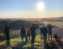 Hikers on top of a hill a sunny day