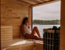 Woman sitting in a sauna