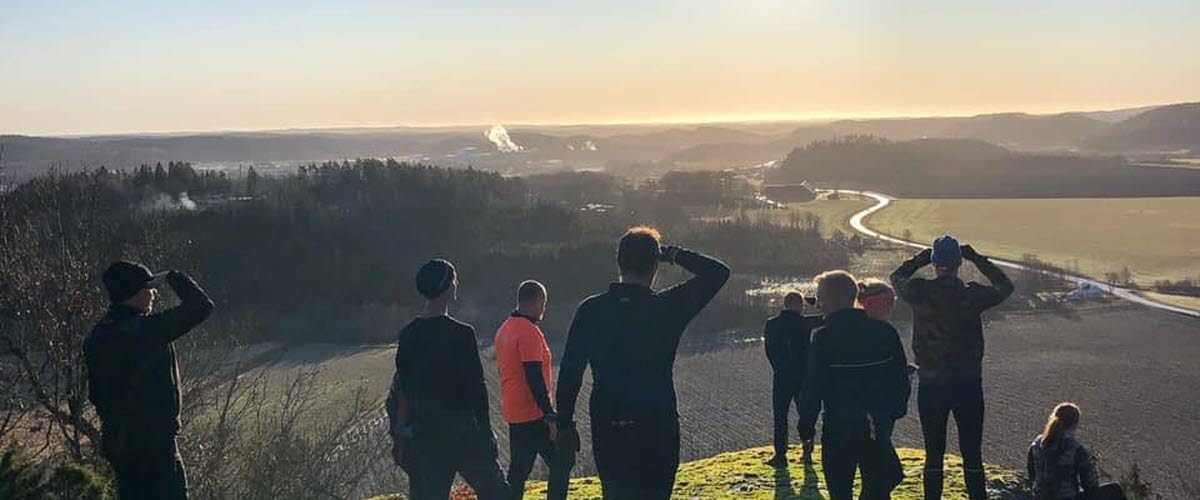 Hikers on top of a hill a sunny day