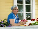 A woman with a plate of pastries.