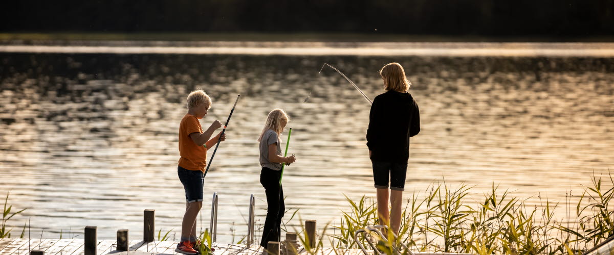 a family is on the dock fishing