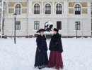 Photo taken of Vänersborg museum from the outside, surrounded with snow and two people in front of it, dressed in 19th-century outfits.