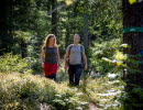 Two persons on a hiking trail.