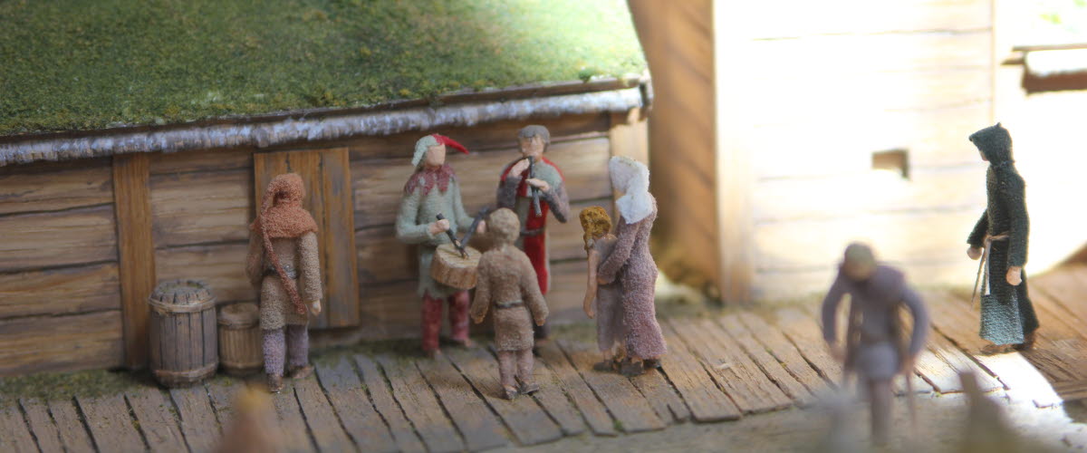 Model of medieval street with people