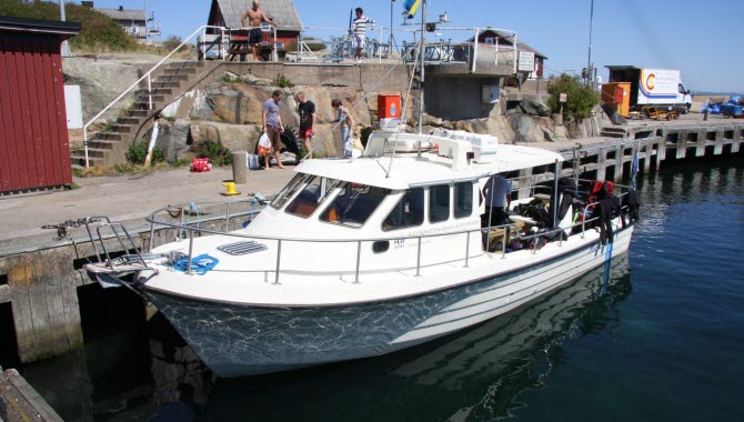 White moto boat in the harbour.