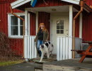 Woman with a dog in a residential environment.