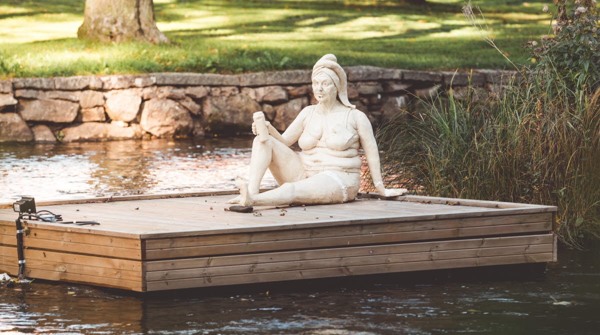 A sculpture by a woman Britt-Marie who sits on a barge in the river Tidan in Tidaholm.