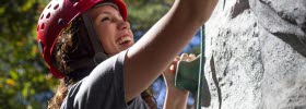 Photo of a woman climbing.