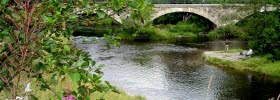 Photo of a man fishing at the Kvistrum bridge.