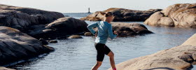 Woman running on the cliffs in Bohuslän