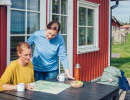 Women who are outside a cabin.