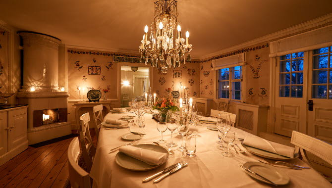The lavish dining room at Tofta Herrgård.