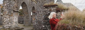 Woman at a ruin.