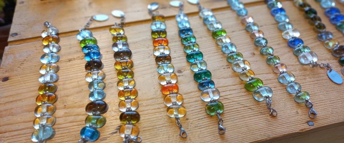 Many bracelets made of glass beads