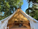 Open glamping tent with furnitures